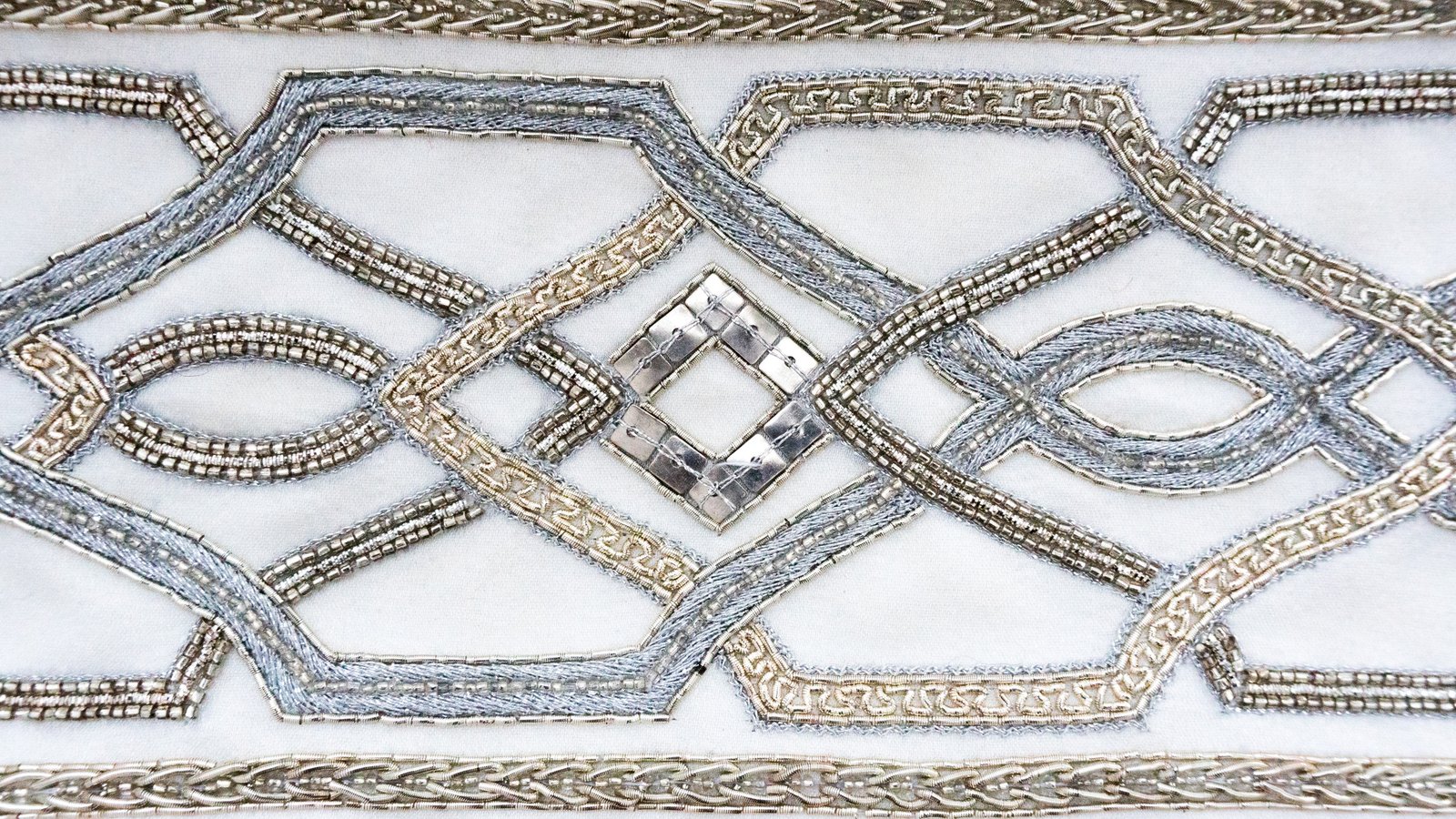 Close-up of the hand embroidery on the Netzach atarah