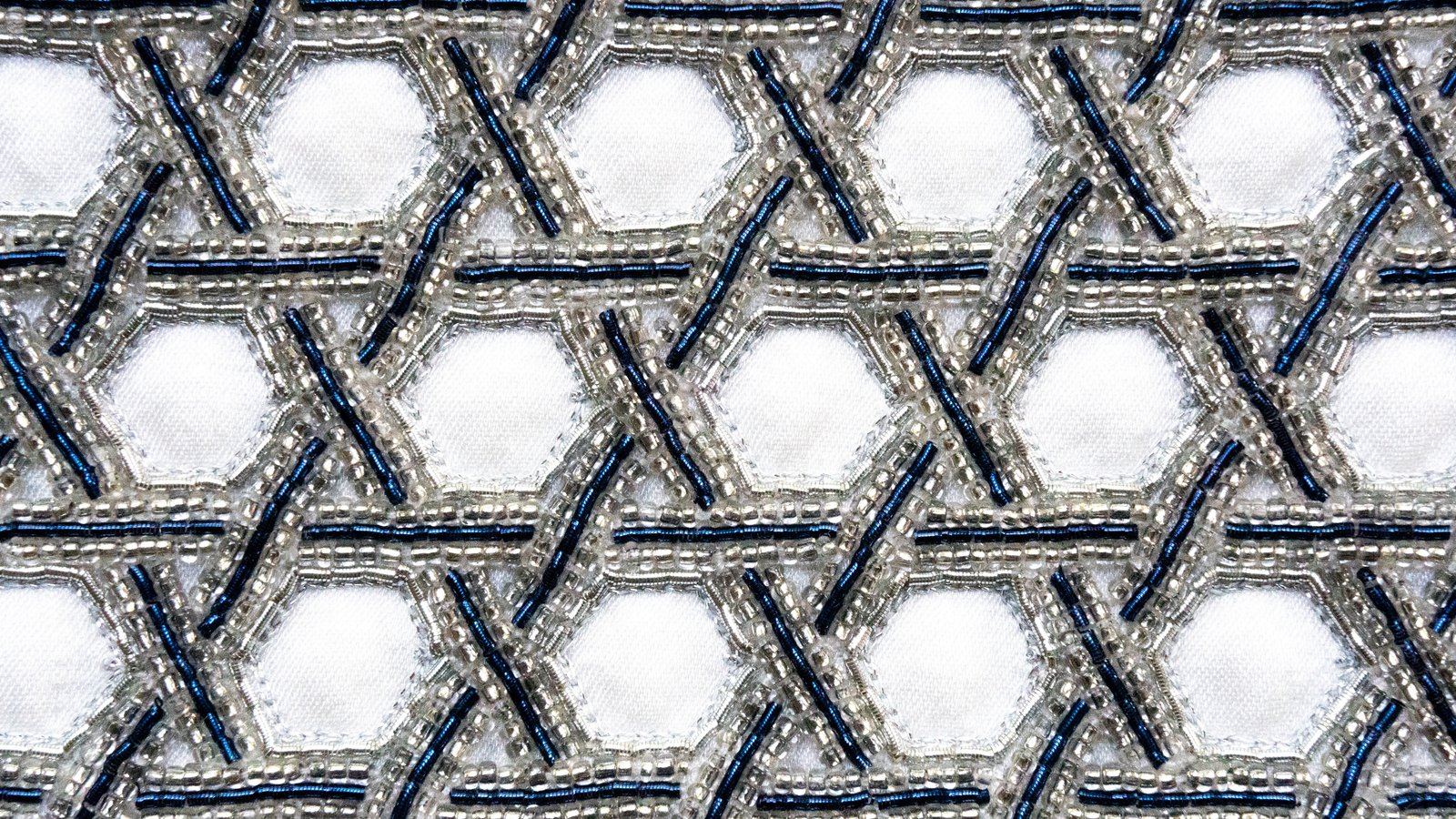 Close-up of the hand embroidery on the Rochmah — Silver atarah
