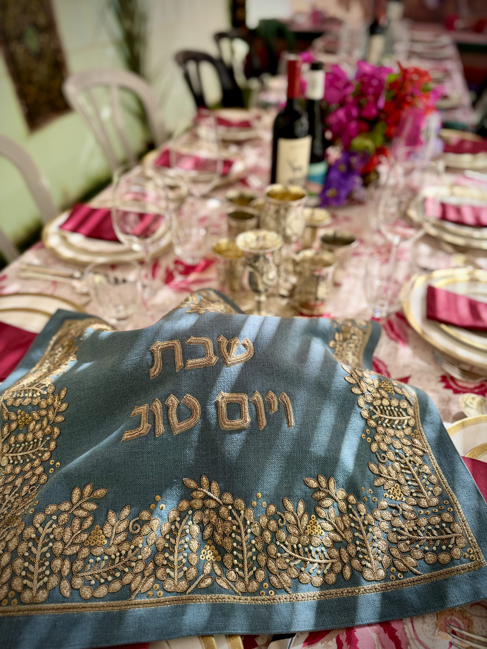 Shabbat table with candles and flowers